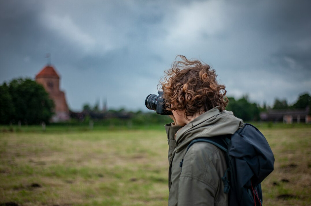 Polish male documentary photographer holding a camera