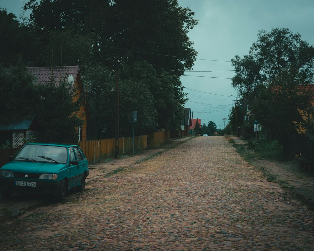 Documentary photographer walking through the rural Polish countryside