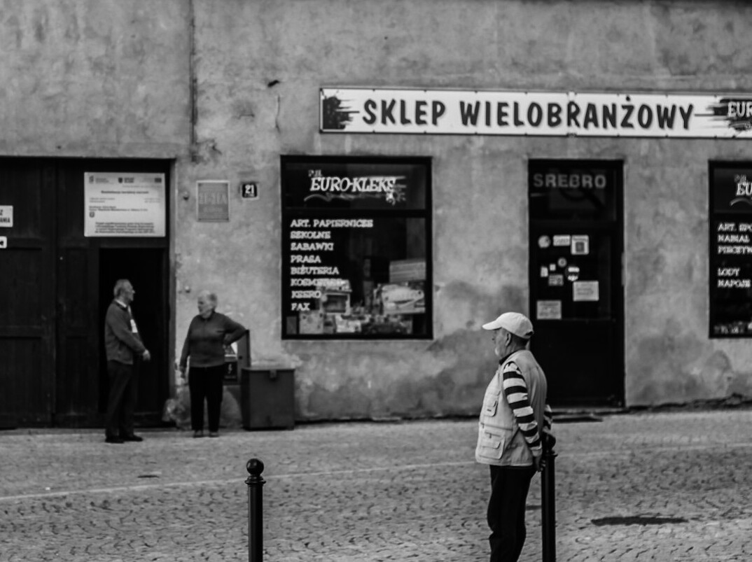 Documentary photographer interviewing an elderly Polish resident